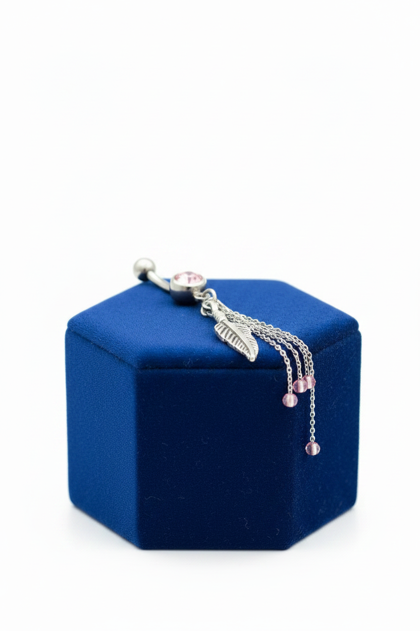 Pink Crystal Feather Chain Belly Button Ring in 316l stainless steel on a blue velvet jewelry display.