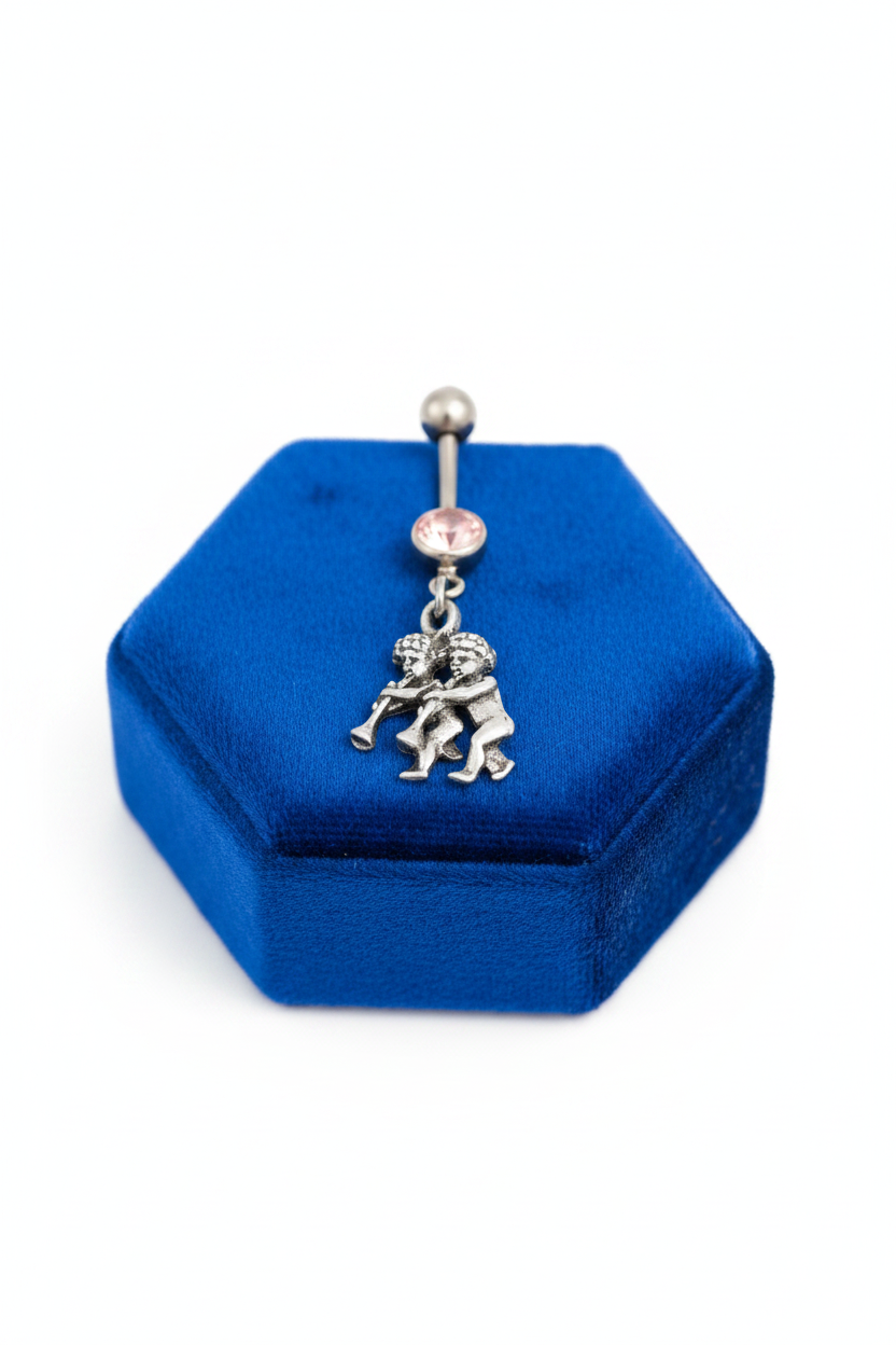 Pink Crystal Gemini Belly Button Ring in 316l stainless steel on a blue velvet jewelry display.