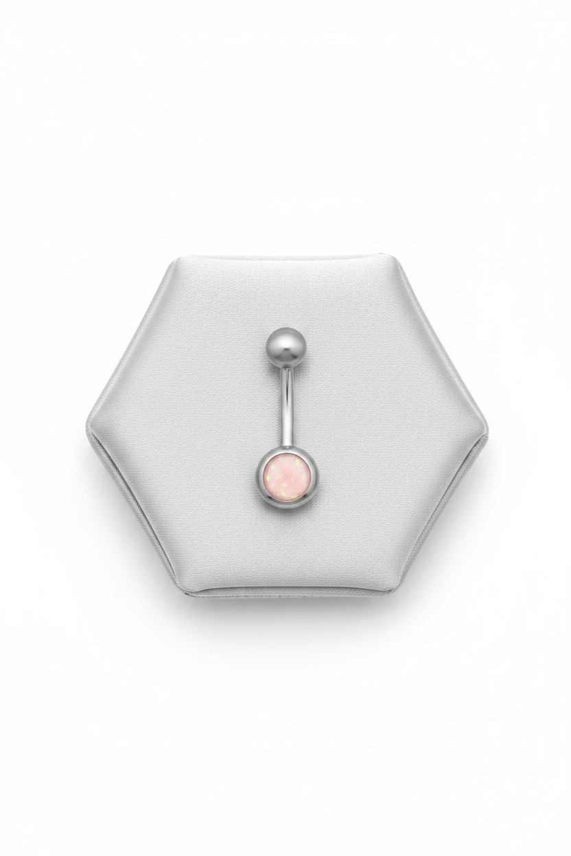 Pink Opal Belly Button Ring in 316l stainless steel on a silver jewelry display.