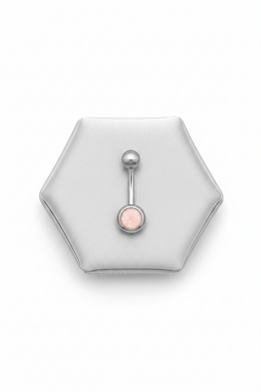 Pink Opal Belly Button Ring in 316l stainless steel on a silver jewelry display.