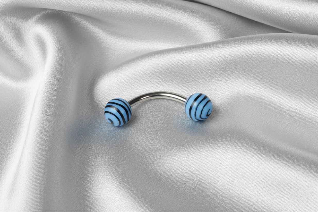 Blue and Black Tiger Striped Acrylic Eyebrow Ring in 316l stainless steel.