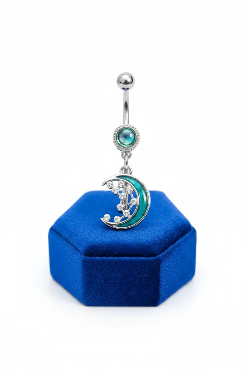 Abalone Moon Belly Button Ring in 316l stainless steel on a blue velvet jewelry display.