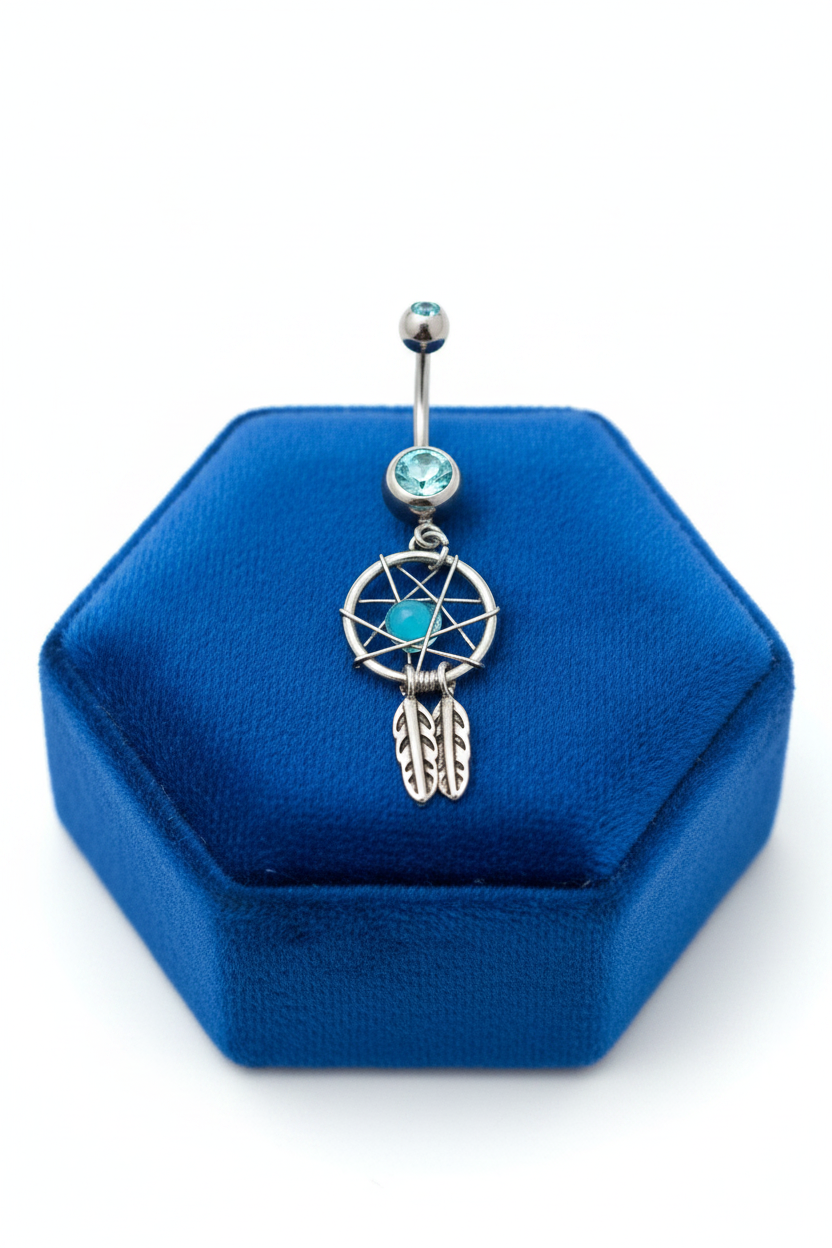 Aqua Crystal Mystical Dream Catcher Belly Button Ring in 316l stainless steel on a royal blue velvet jewelry display.