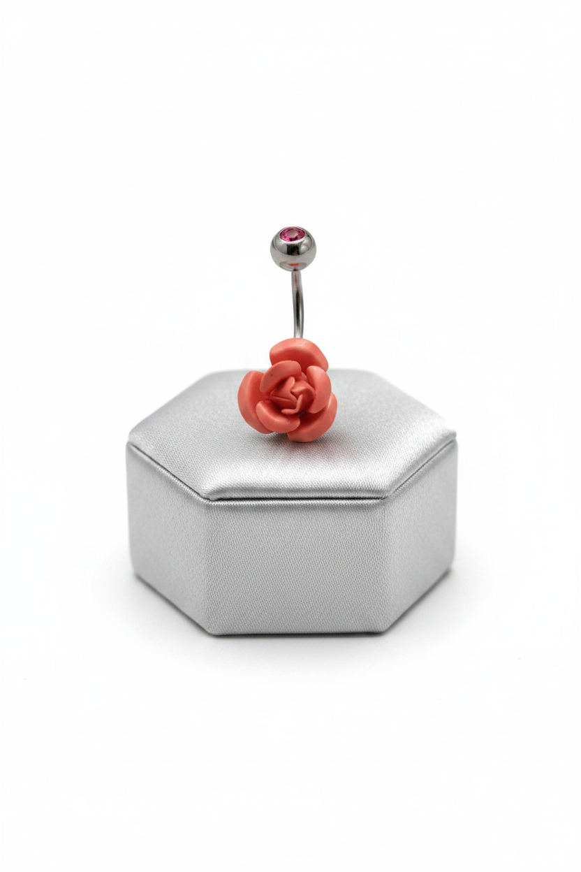 Red Rose Belly Button Ring in 316l stainless steel on a silver jewelry display.