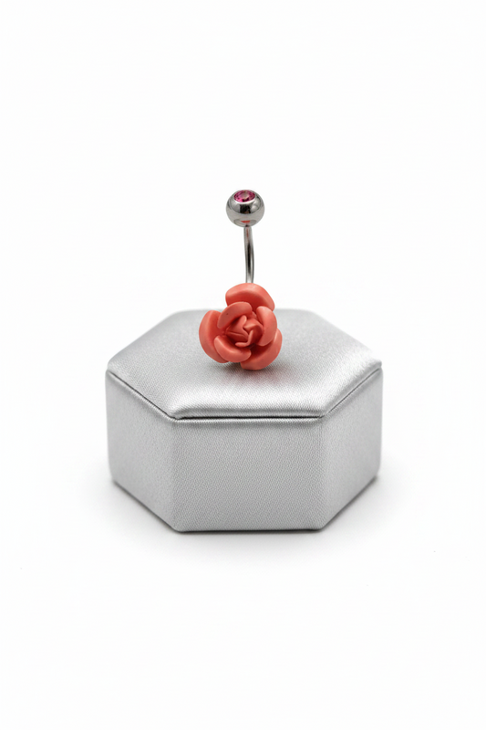 Red Rose Belly Button Ring in 316l stainless steel on a silver jewelry display.