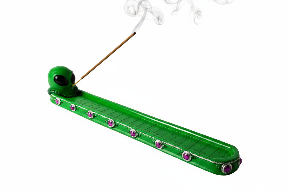 Peaceful Alien Visitor Resin Incense Holder on a white background with incense burning and smoke rising.