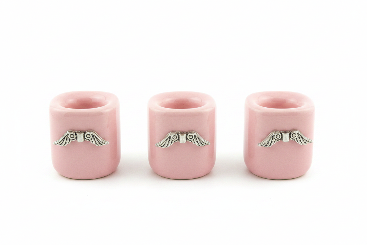 Pink Wings Ceramic Mini Candle Holder Set of Three on a white background.