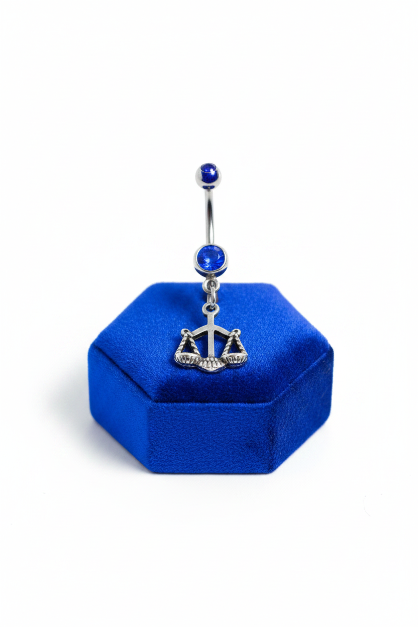 Blue Crystal Libra Belly Button Ring in 316l stainless steel on a blue velvet jewelry display.