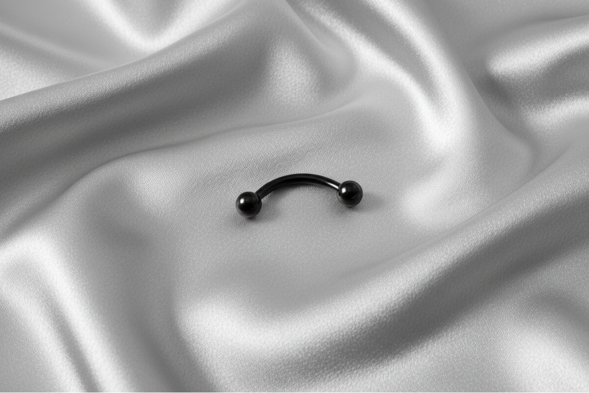 Black Titanium Ball Eyebrow Ring in black titanium.