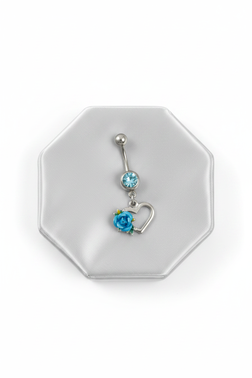 Aqua Crystal Rose Heart Belly Button Ring in 316l stainless steel on a silver silk jewelry display.