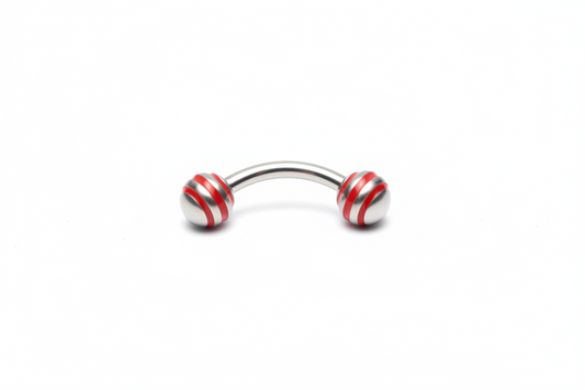 Red Striped Steel Ball Eyebrow Ring in 316l stainless steel close up detail.
