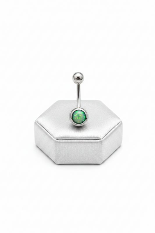 Green Opal Belly Button Ring in 316l stainless steel on a silver silk jewelry display upright position.