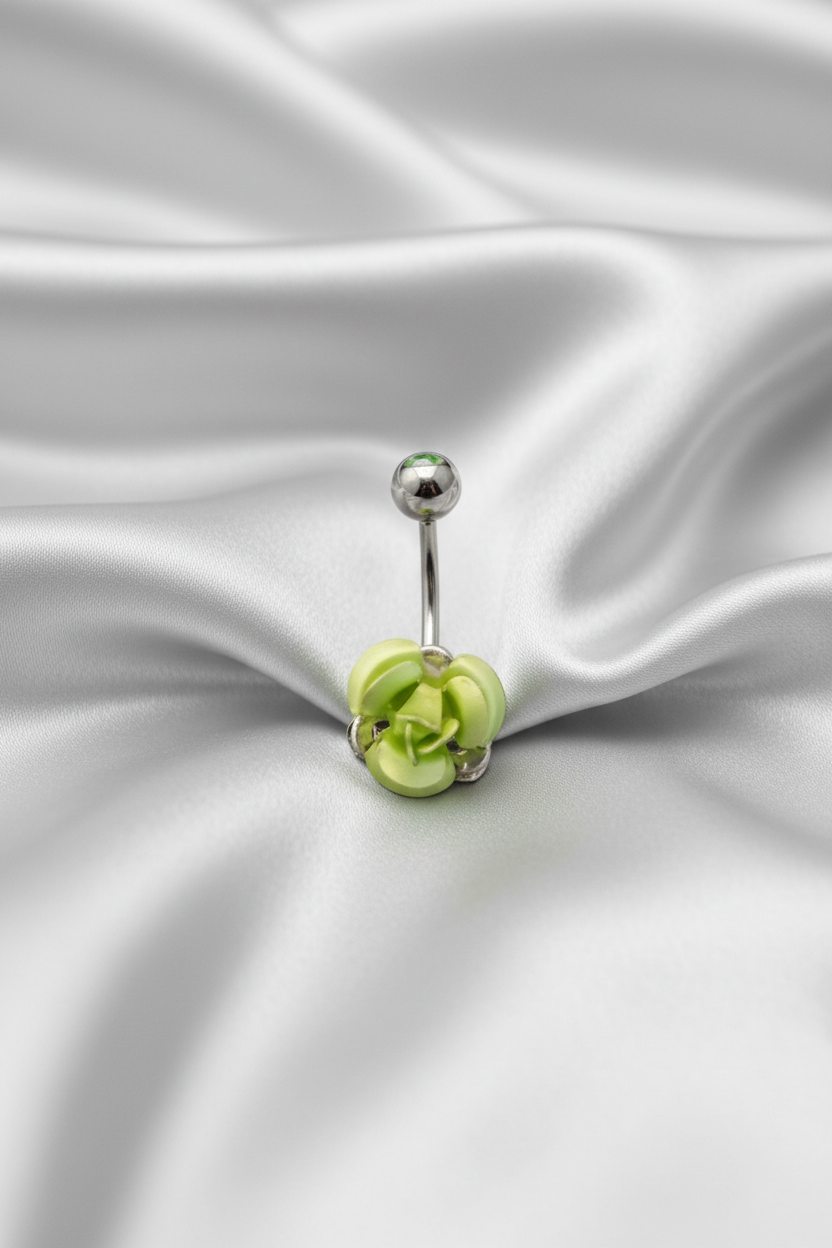 Green Rose Belly Button Ring in 316l stainless steel on silver silk fabric.
