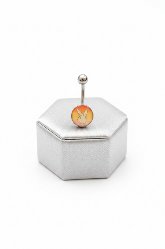 Rainbow Bunny Belly Button Ring in 316l stainless steel on a silver jewelry display.