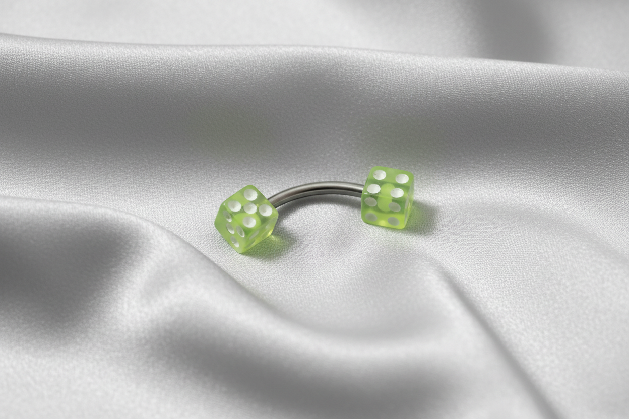 Yellow Acrylic Dice Eyebrow Ring in 316l stainless steel.