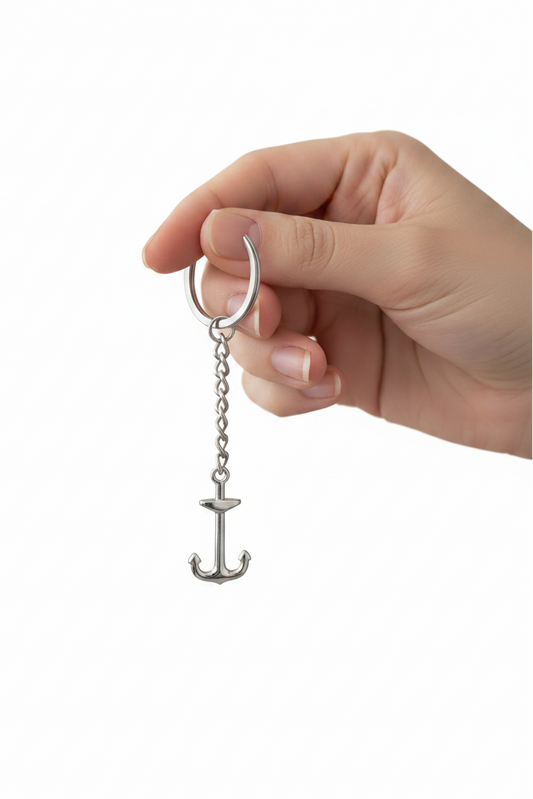 Anchor Handmade 316L Stainless Steel Charm Keychain held by a hand showing scale.