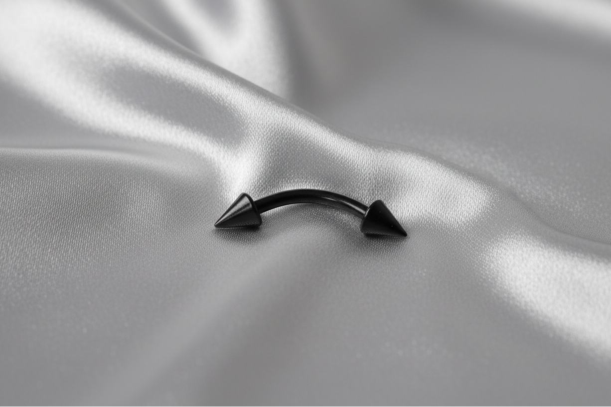 Black Spike Titanium Eyebrow Ring in black titanium.