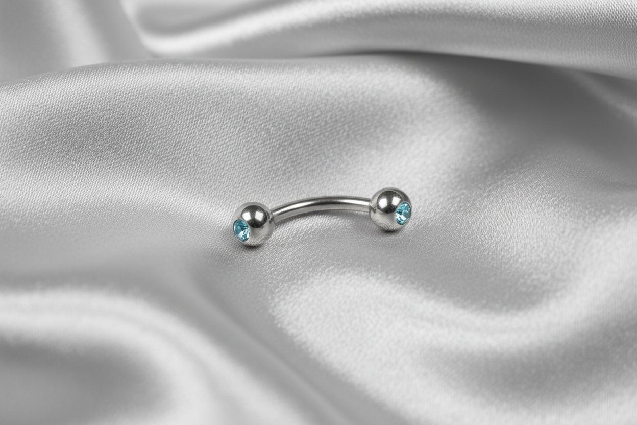 Baby Blue Crystal Eyebrow Ring in 316l stainless steel.