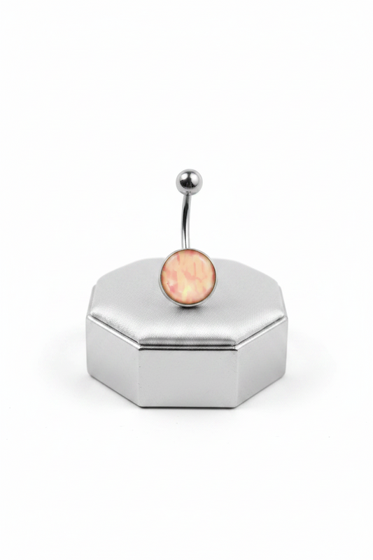 Pink Camouflage Belly Button Ring in 316l stainless steel on a silver jewelry display upright position.