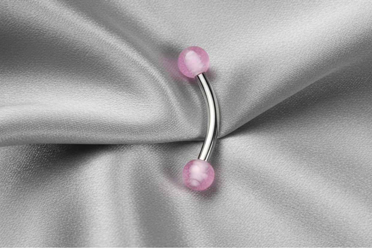 Purple Glow Ball Acrylic Eyebrow Ring in 316l stainless steel.