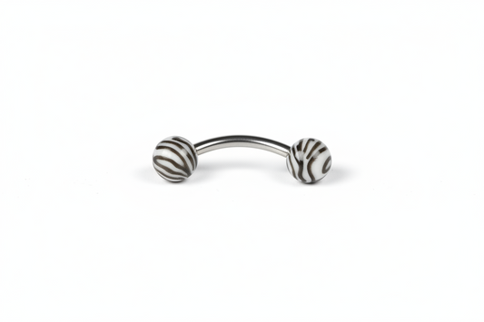 Black and White Tiger Striped Acrylic Eyebrow Ring in 316l stainless steel close up detail.