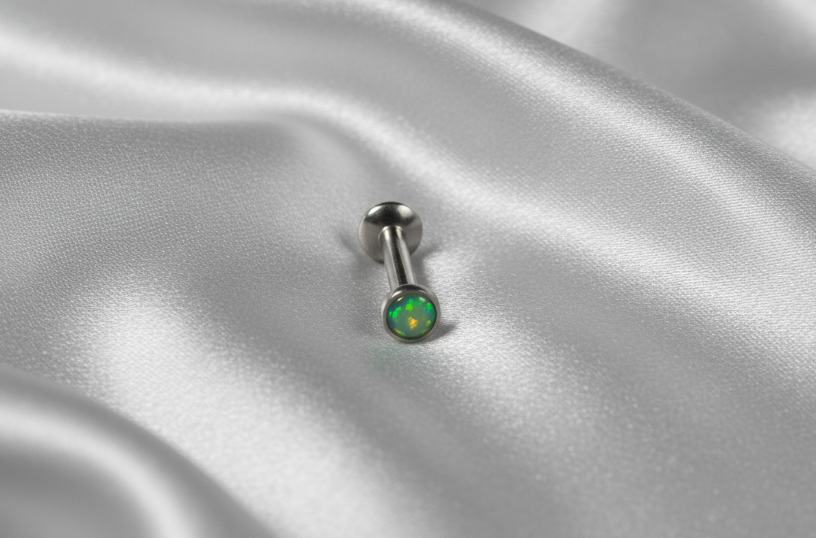 Internally Threaded Green Opal Labret Lip Ring in 316l stainless steel.