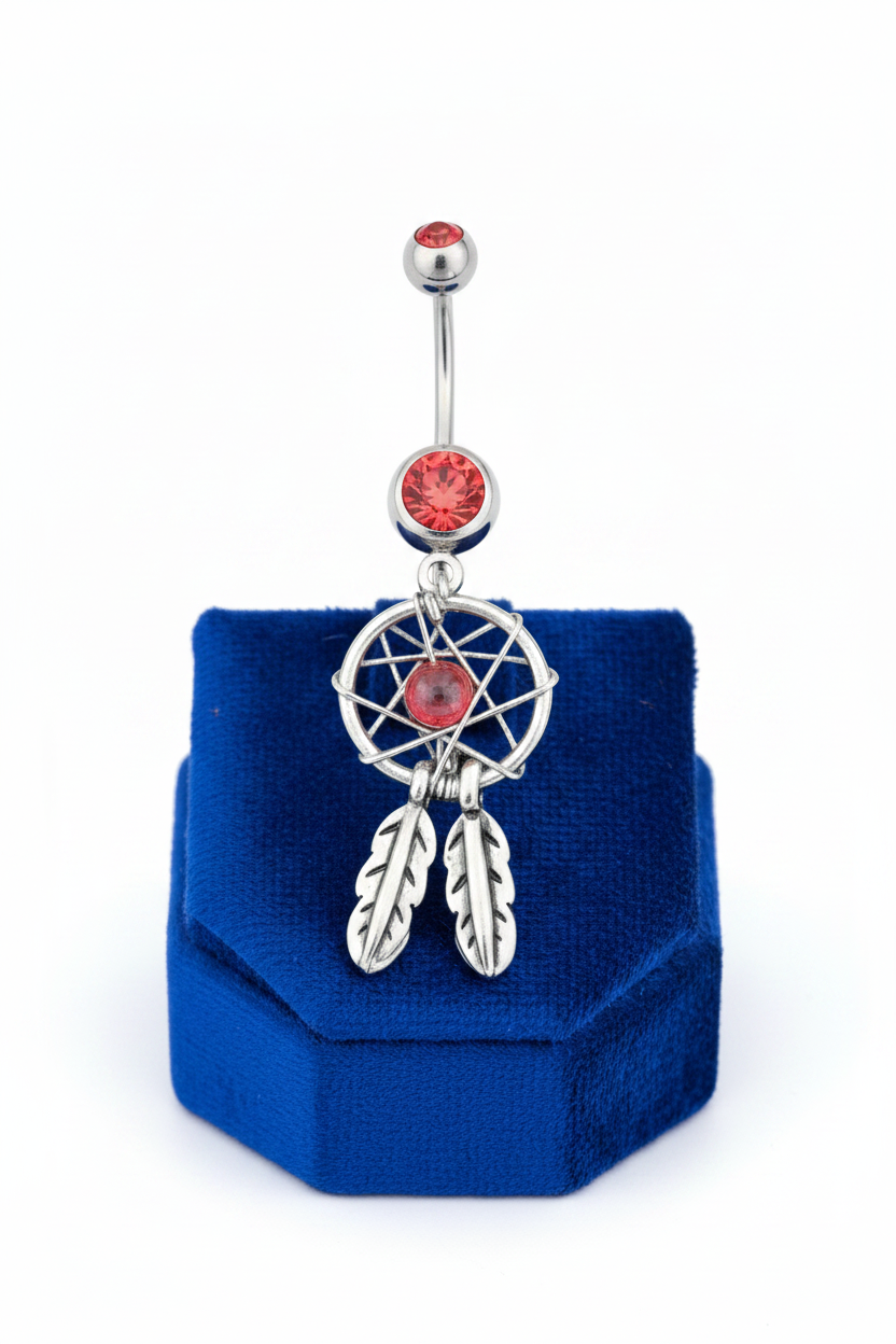 Red Crystal Mystical Dream Catcher Belly Button Ring in 316l stainless steel on a blue velvet jewelry display.