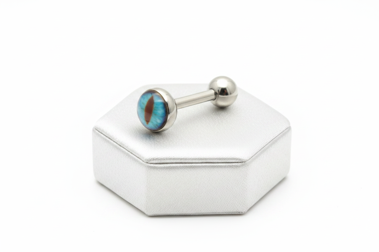 Aqua Snake Eye tongue barbell in 316l stainless steel on a silver jewelry display.