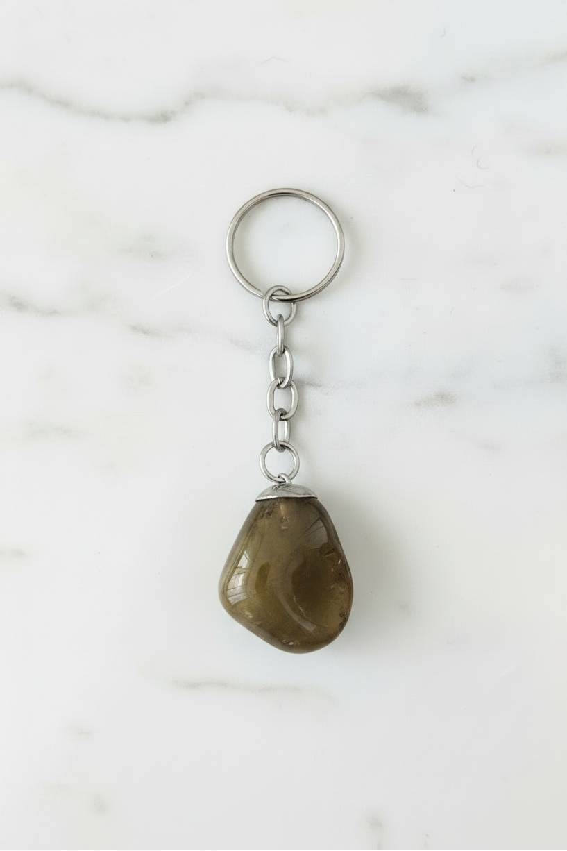 Smoky Quartz Natural Earth Stone Handmade Steel Plated Keychain on a white marble surface.