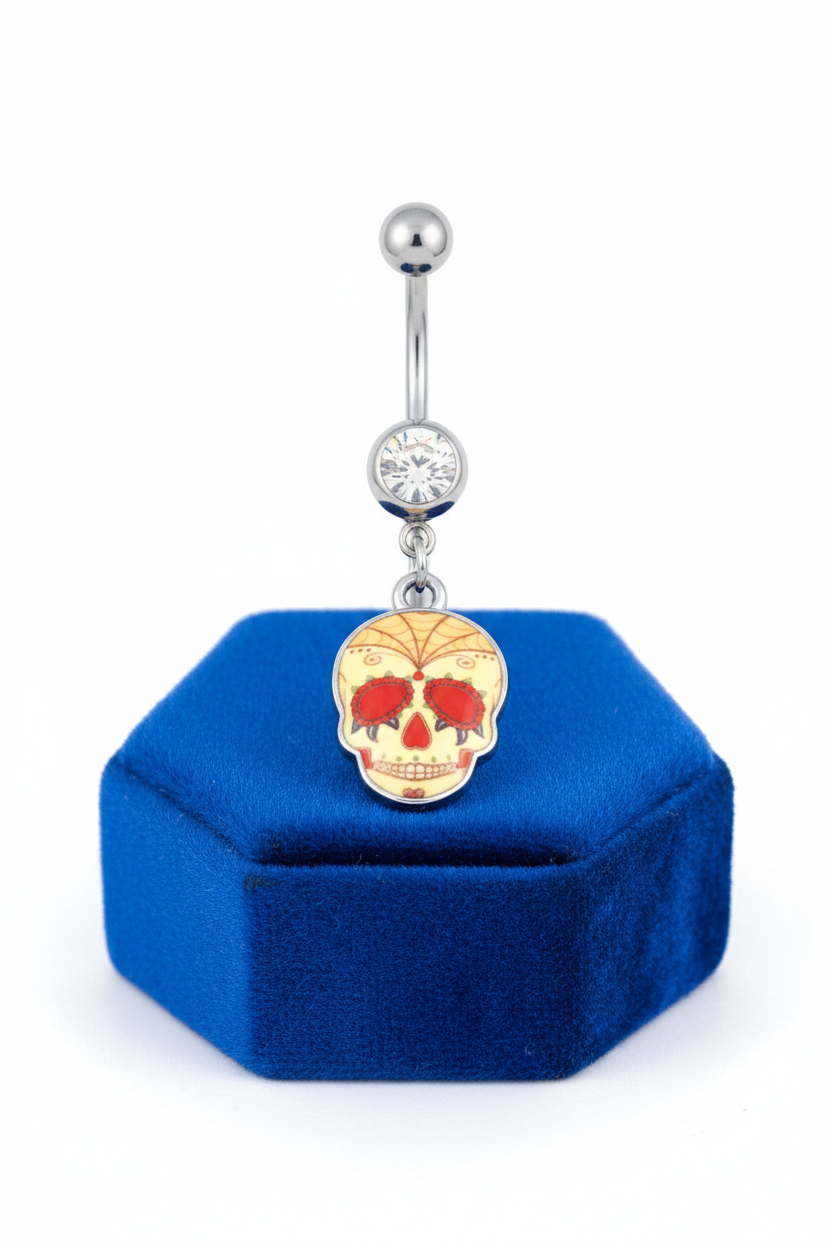 Clear Crystal Spider Web Sugar Skull Belly Button Ring in 316l stainless steel on a blue velvet jewelry display.