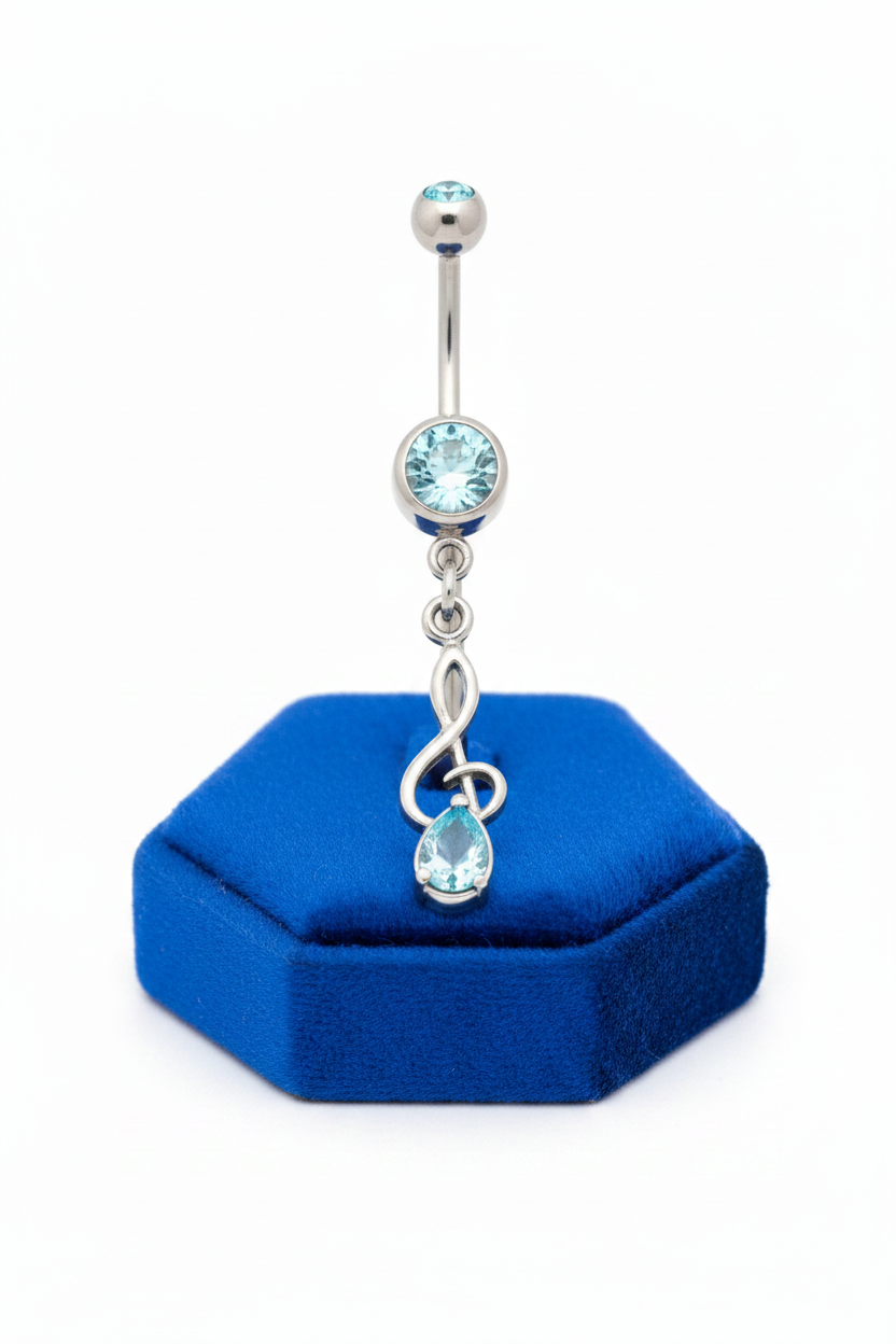 Aqua Crystal Treble Clef Belly Button Ring in 316l stainless steel on a blue velvet jewelry display.