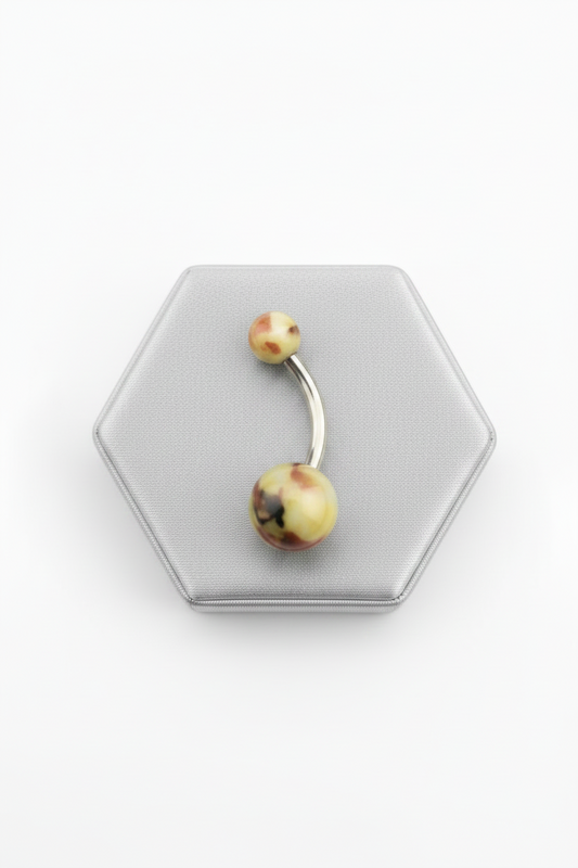 Green & Brown Camouflage Acrylic Belly Button Ring in 316l stainless steel on a silver jewelry display.