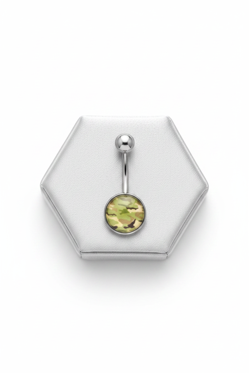 Green Camouflage Belly Button Ring in 316l stainless steel on a silver silk jewelry display.