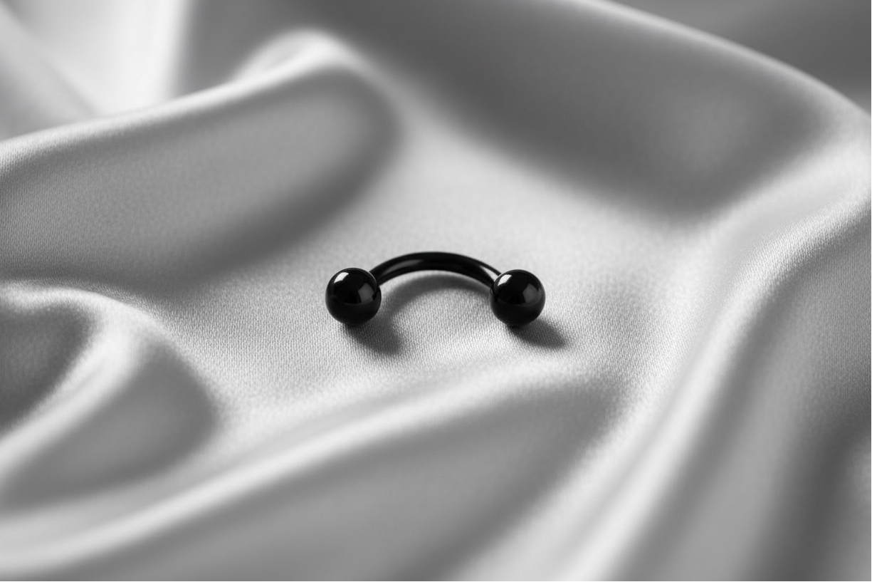 Black Titanium Multipurpose Eyebrow Ring in black titanium.