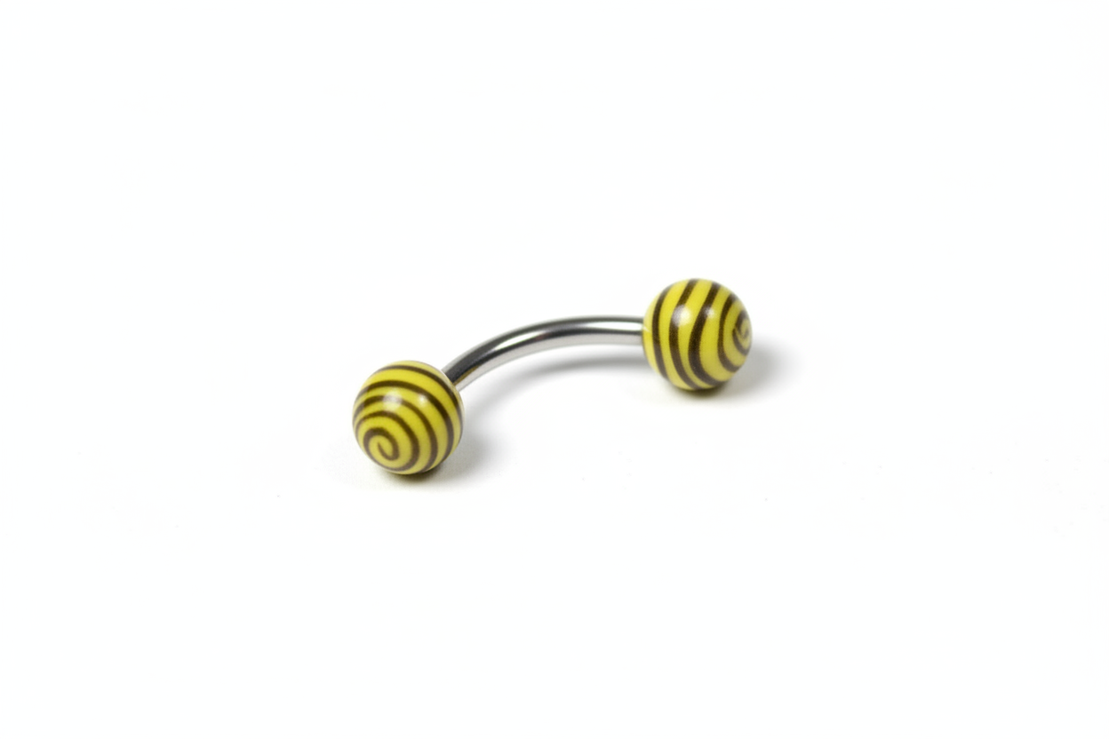 Yellow and Black Tiger Striped Acrylic Eyebrow Ring in 316l stainless steel close up detail.