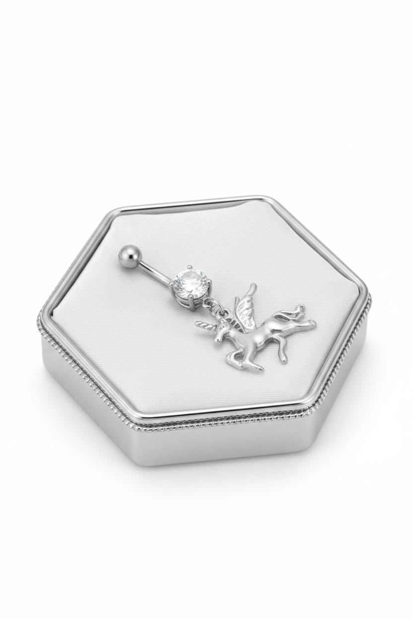 Clear Crystal Pegasus Unicorn Belly Button Ring in 316l stainless steel on a silver silk jewelry display.