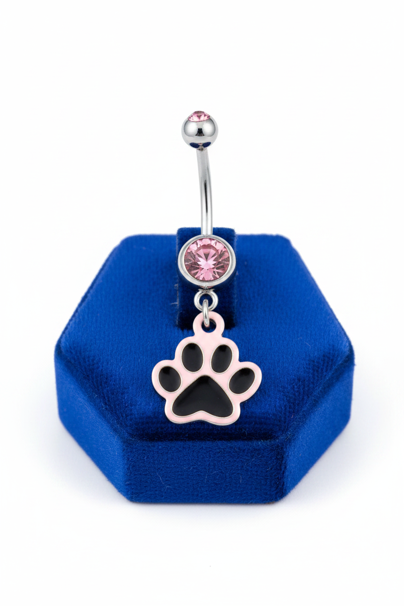 Pink Crystal Puppy Paw Belly Button Ring in 316l stainless steel on a blue velvet jewelry display.