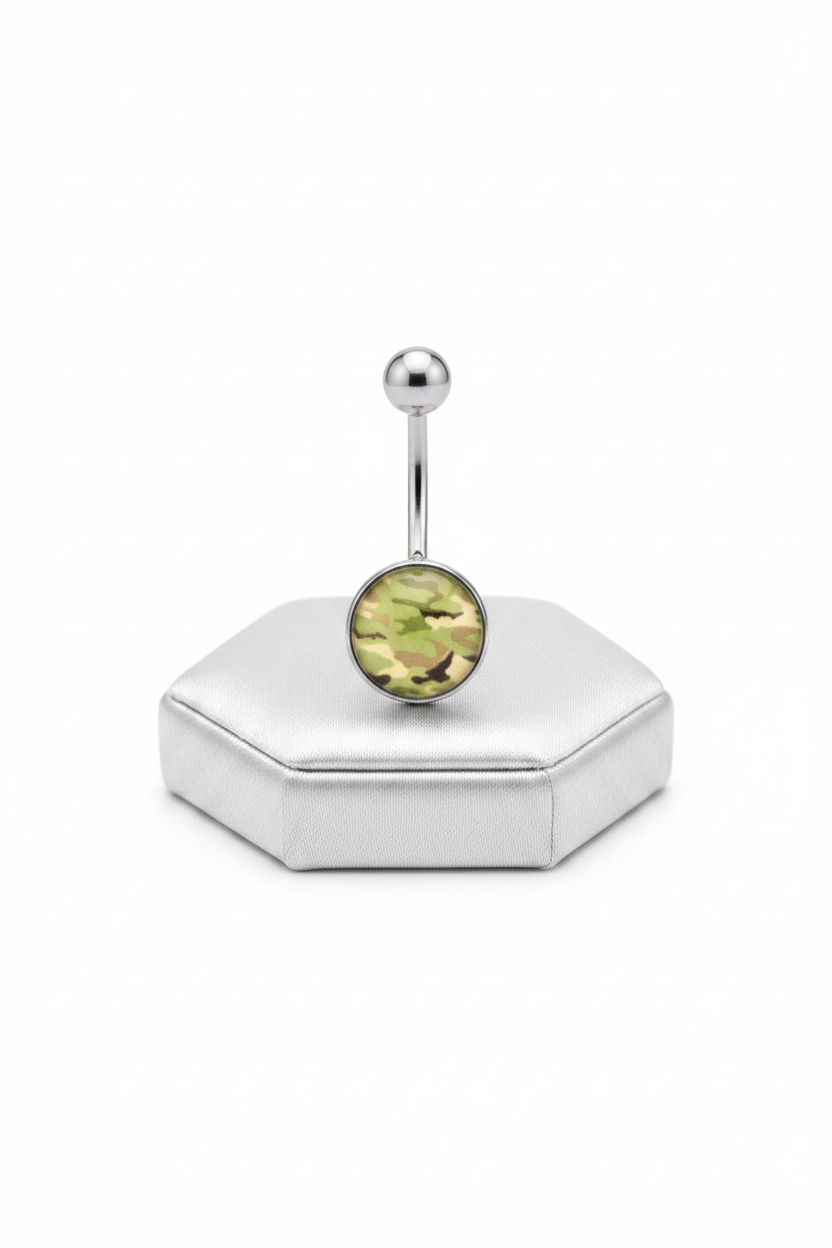 Green Camouflage Belly Button Ring in 316l stainless steel on a silver silk jewelry display upright position.