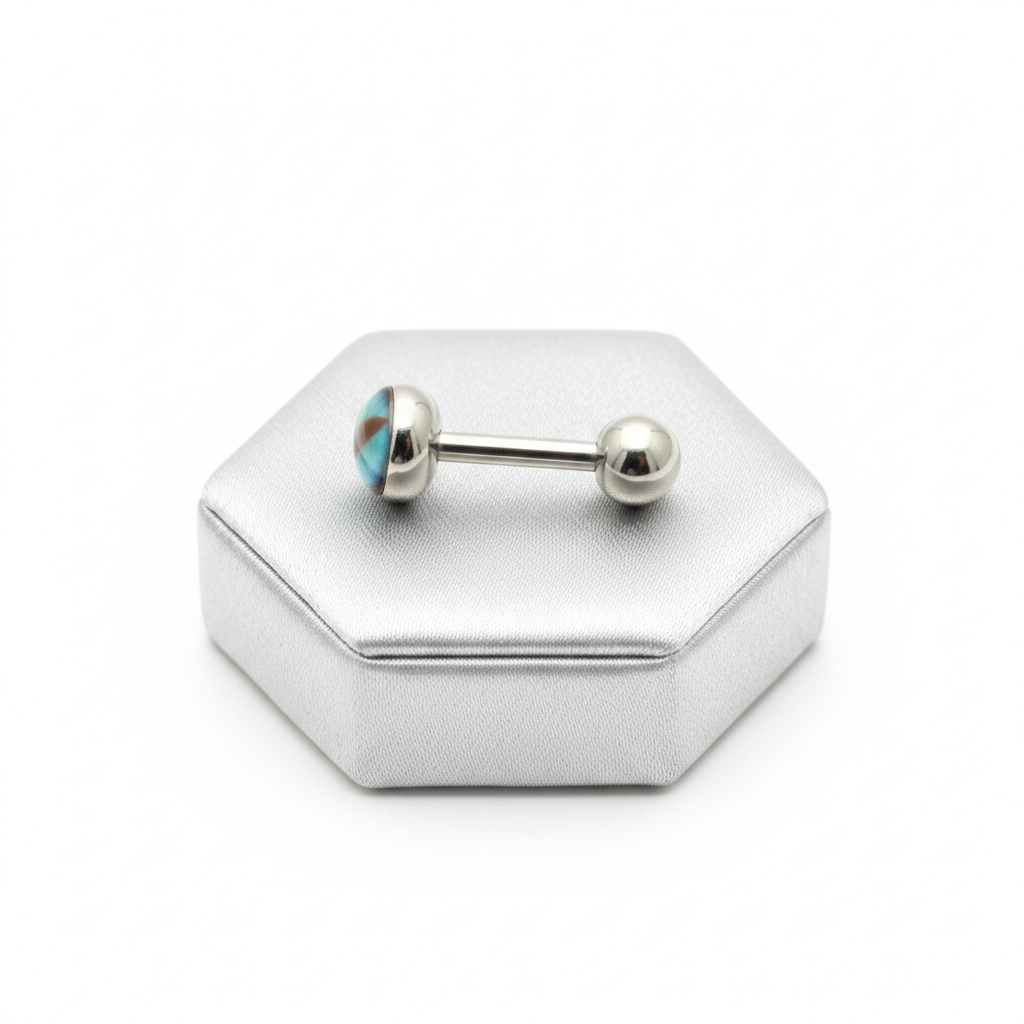 Aqua Snake Eye tongue barbell in 316l stainless steel on a silver jewelry display side view.