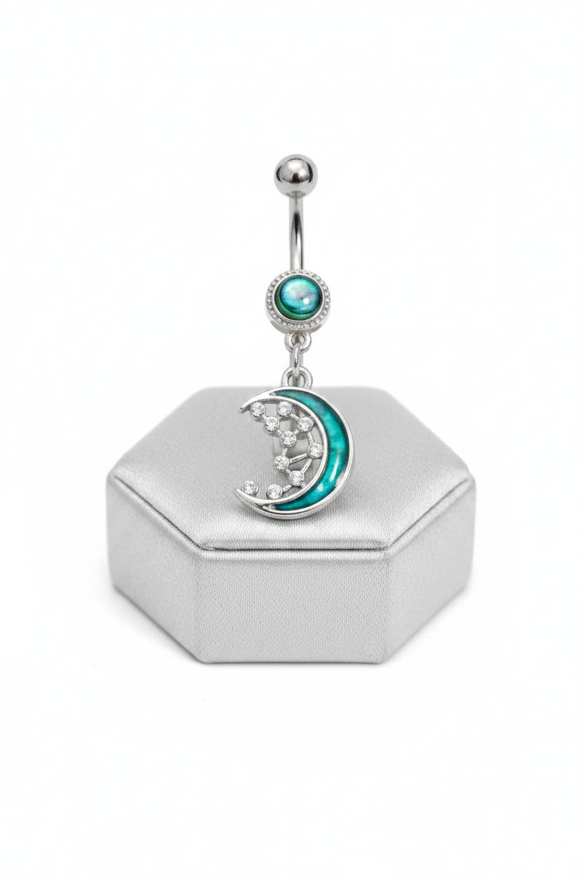 Abalone Moon Belly Button Ring in 316l stainless steel on a silver silk jewelry display.