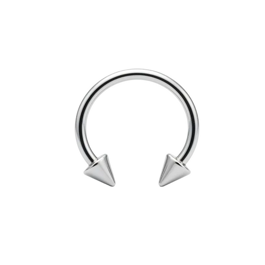 Spiked Steel Horseshoe Curved Barbell in 316l stainless steel close up detail.