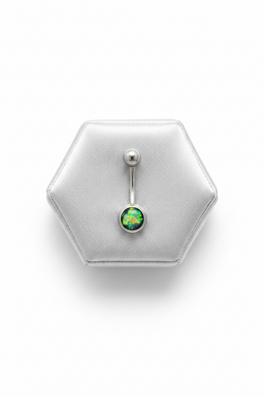 Black Opal Belly Button Ring in 316l stainless steel on a silver silk jewelry display.