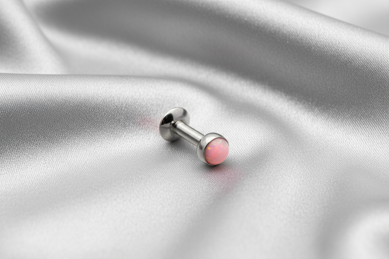 Internally Threaded Soft Pink Opal Labret Lip Ring in 316l stainless steel.