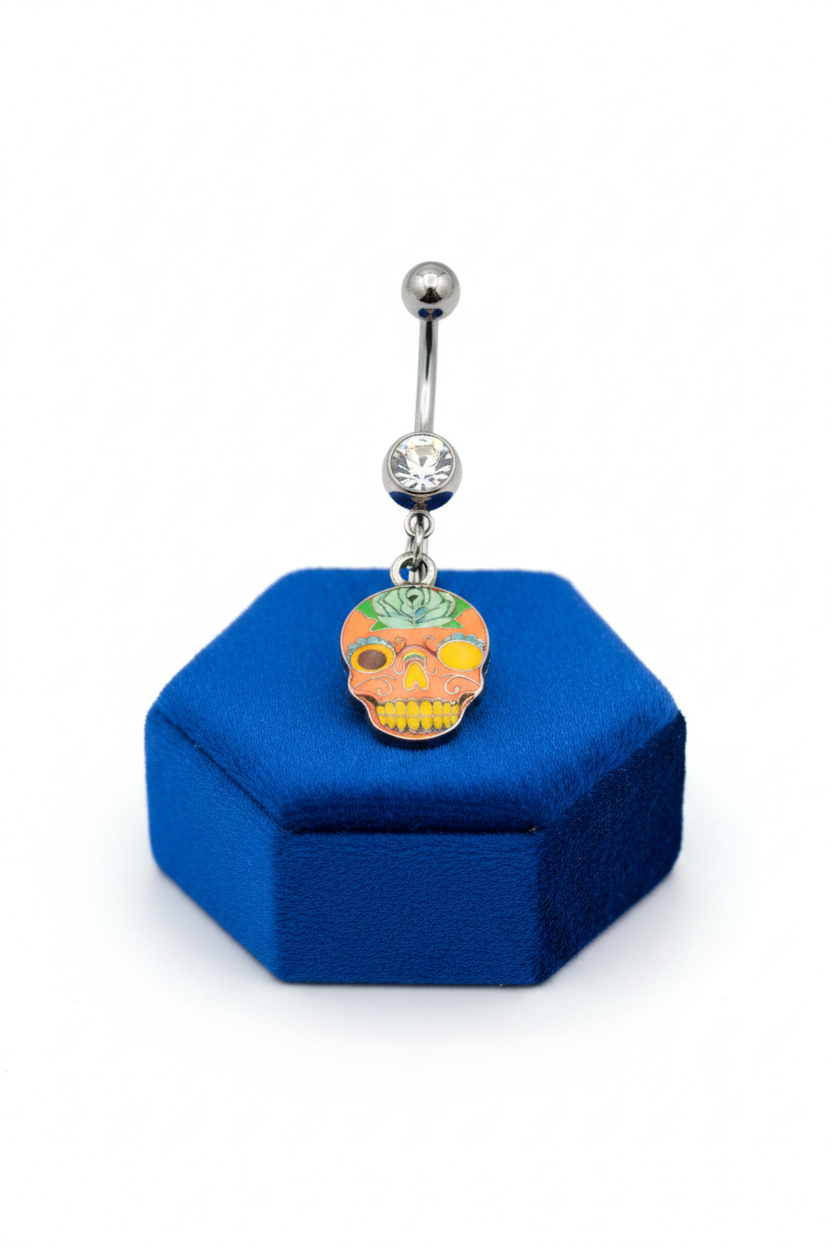 Clear Crystal Floral Sugar Skull Belly Button Ring in 316l stainless steel on a blue velvet jewelry display.