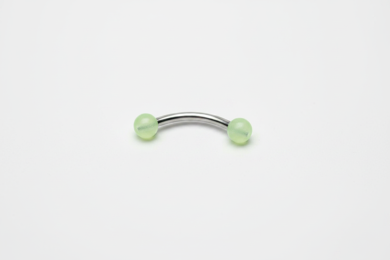 Yellow Glow Ball Acrylic Eyebrow Ring in 316l stainless steel horizontal angle.