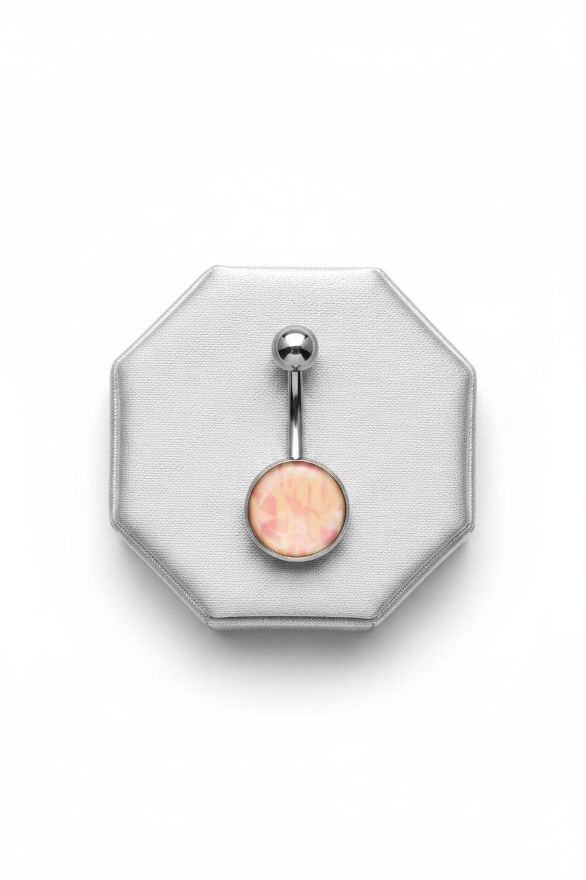 Pink Camouflage Belly Button Ring in 316l stainless steel on a silver silk jewelry display.
