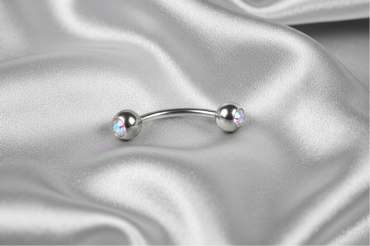 Aurora Clear Crystal Eyebrow Ring in 316l stainless steel.