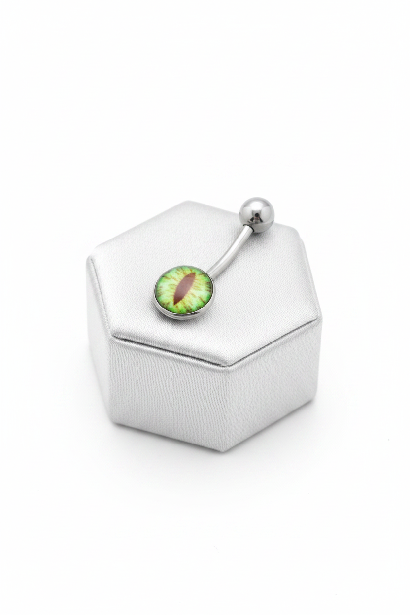 Green Snake Eye Belly Button Ring in 316l stainless steel on a silver jewelry display.