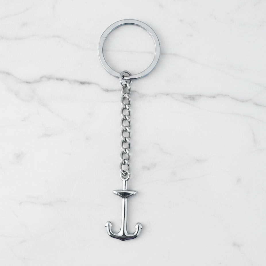 Anchor Handmade 316L Stainless Steel Charm Keychain on a white marble surface.