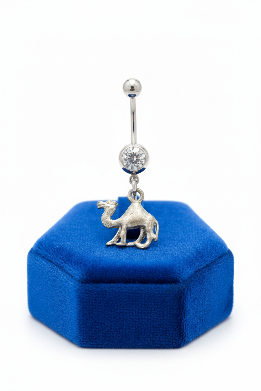 Clear Crystal Desert Camel Belly Button Ring in 316l stainless steel on a blue velvet jewelry display.